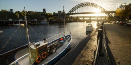 Image of a boat on the River Tyne with the Tyne Bridge in the background