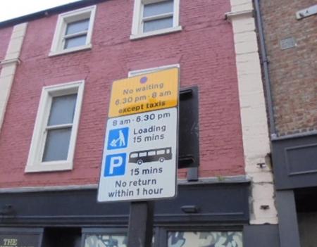 The shared use sign is for taxis, loading and coaches. The first part of the sign is yellow with a no waiting symbol and states ‘No waiting 6.30pm – 8am except taxis’. Underneath is the loading symbol advising ‘8am – 6.30pm loading 15 minutes. Then a picture of a coach advising ’15 mins no return within 1 hour