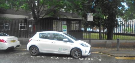 Car club bay with car club car parked. The bay marking on the highway states ‘car club only’ and car club sign