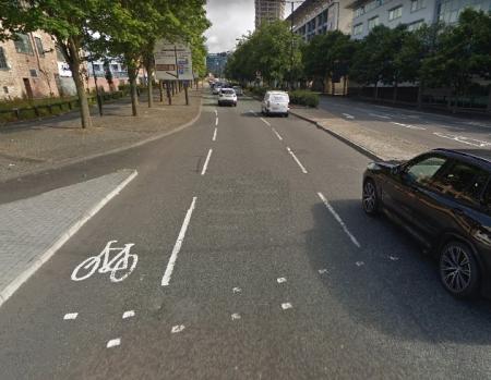 Advisory cycle track, with bicycle marked on the highway with intermitted white lines