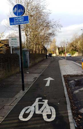 Mandatory cycle track, with blue sign cycle sign tactile white line and bicycle marked on track