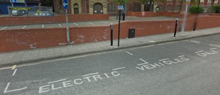 Electric charging bay, marked on the highway ‘Electric Vehicle’s only’