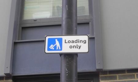 Loading only sign, the sign has a picture of loading/unloading symbol and states ‘Loading only’