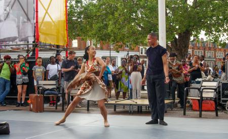 two ballet dancers performing outdoors