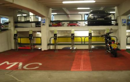 Motorcycle parking bays with M/C marked in bays, with motorcycle stand