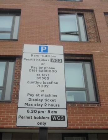 The shared use sign in use for permit holders and pay and display ticket holders. The sign states ‘8am – 6.30pm Permit holders or Pay By Phone or Pay at machine’ The sign then advises ‘6.30pm – 8am Permit holders only’