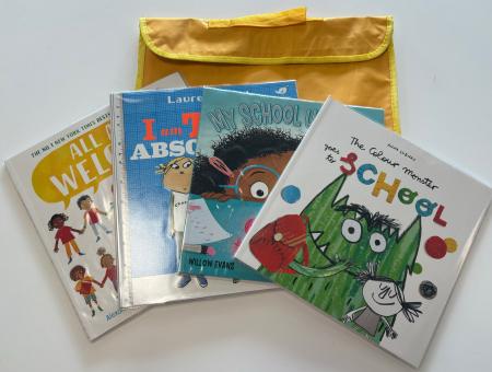 A yellow school bag with four picture books about school