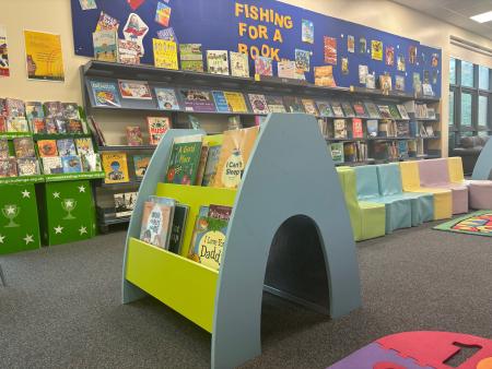 Gosforth library childen's area with soft chairs and kinderboxes