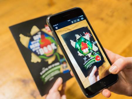 the boy with his head stuck in a book augmented reality