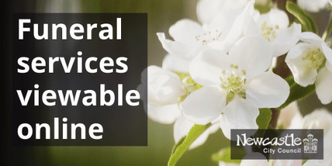 A photo of white flowers with the text "funeral services viewable online"