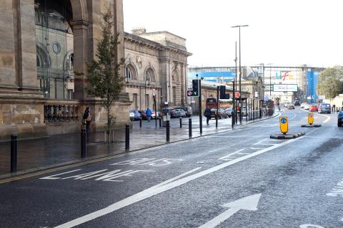 Photo shows the road with a bus lane outside Central Station in Newcastle.