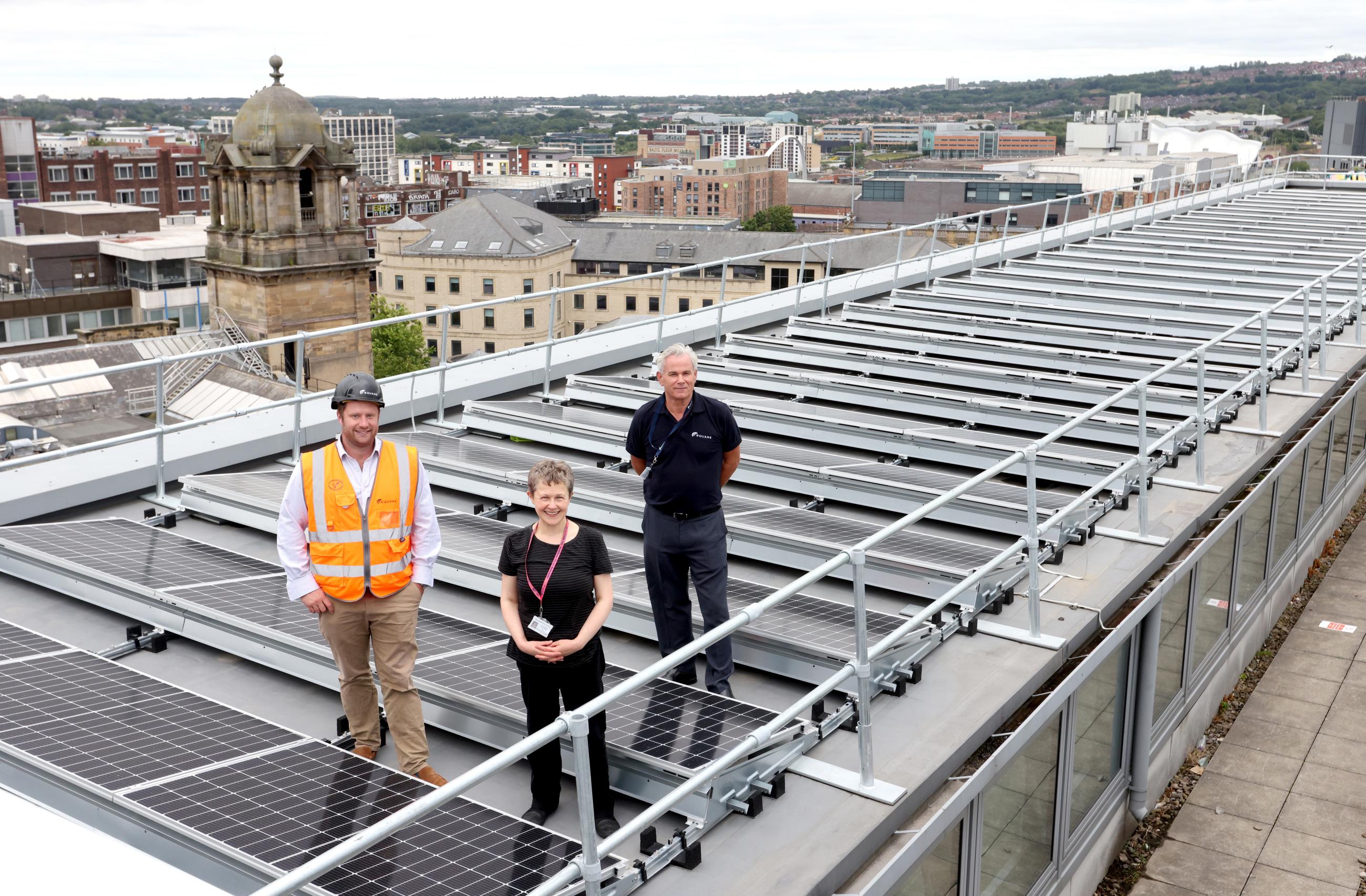 Joe Logan, Construction Manager at EQUANS; Cllr Jane Byrne, Newcastle City Council’s Connected City Cabinet member and Tim Wood, Director of Sustainability & Innovation at EQUANS on the roof of Newcastle City Library