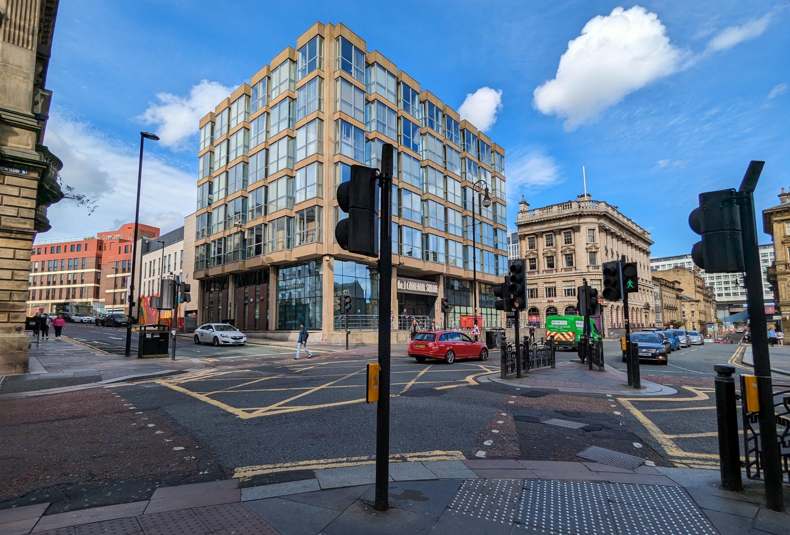 Photo shows a Newcastle city centre junction with a pedestrian island in the centre.