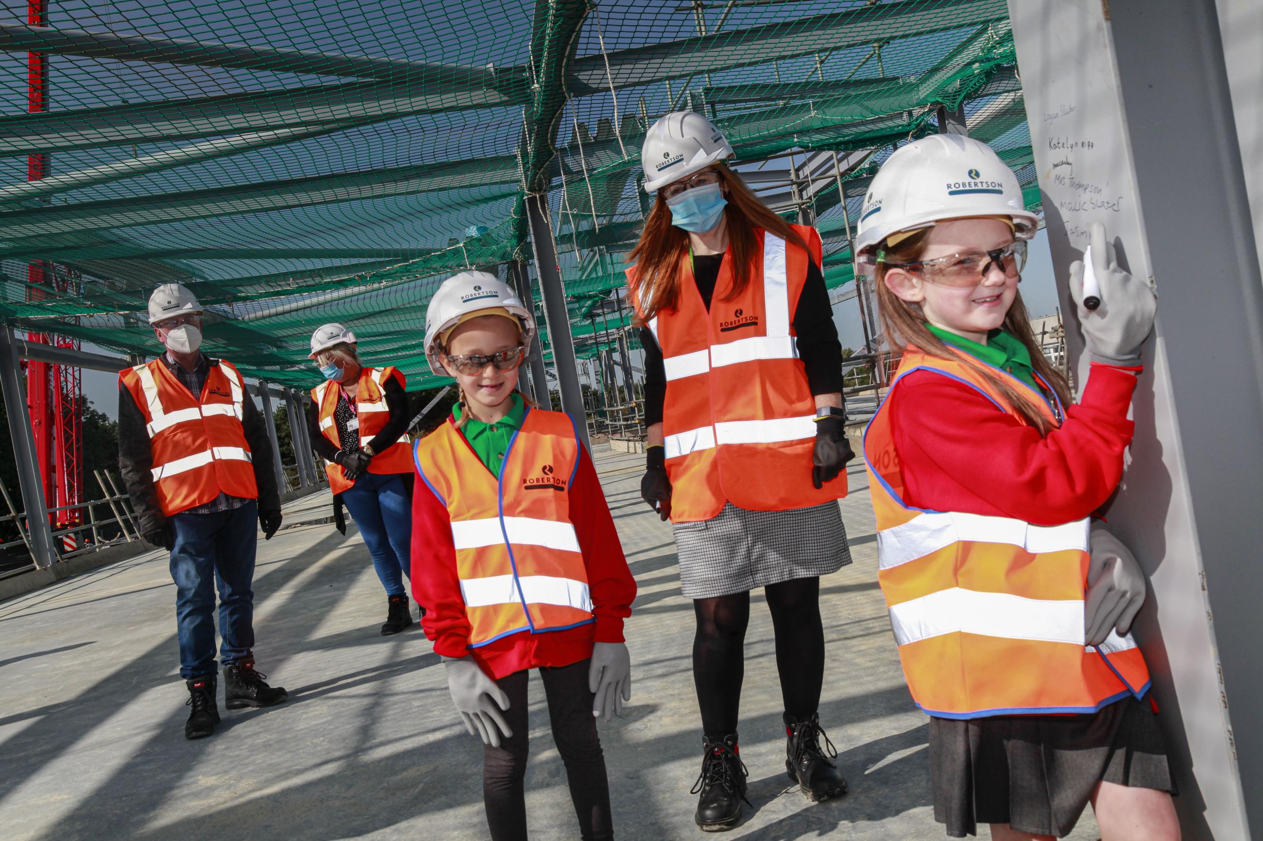 Pupils from a social bubble at Simonside Primary exploring their new build school