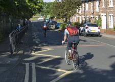Image of 2 cyclists cycling down Mowbray Street where the Hotspur School Street is located