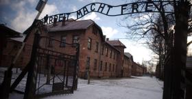 Entrance to Auschwitz with the words 'Arbeit Macht Frei' meaning work gives you freedom written above.