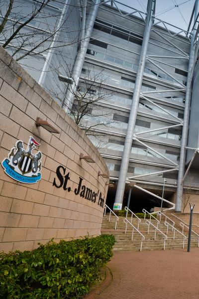 Some steps leading into St James' Park beside the NUFC club crest